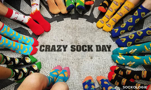 A photo of people in a circle with crazy socks on