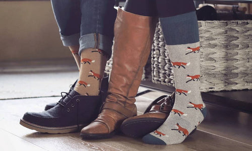 a couple wearing matching boot socks
