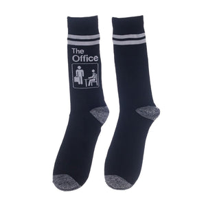 Close-up of a pair of navy blue socks with The Office logo and white stripes.