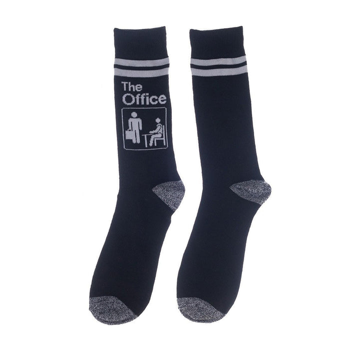 Close-up of a pair of navy blue socks with The Office logo and white stripes.