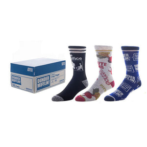 Product shot of three pairs of The Office crew socks. One pair is navy blue with The Office logo, one is gray with beet designs, and one is blue with Dunder Mifflin branding.