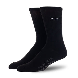 Flat lay: A single pair of black Friends socks with the 'Friends' logo embroidered on the cuff.
