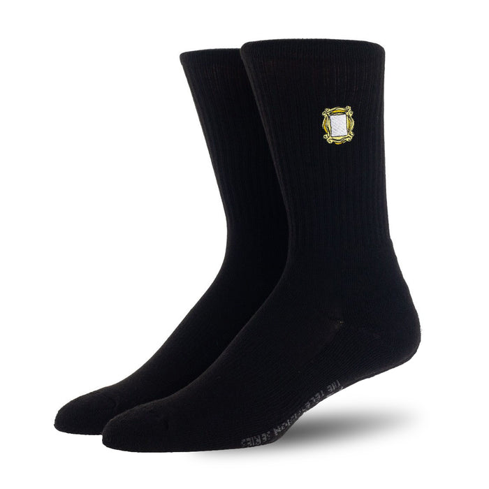 A pair of black socks with a yellow picture frame embroidered on the ankle.