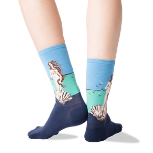 A pair of socks with _The Birth of Venus_ by Sandro Botticelli on the left sock and a blue background on the right sock.