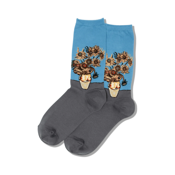 Close-up of a pair of blue and gray crew socks featuring Van Gogh's Sunflowers.