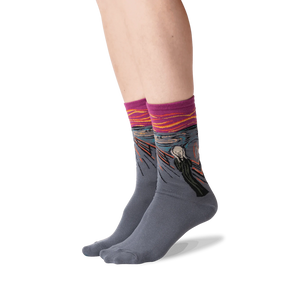 The Scream socks shown on a person's legs against a black background.