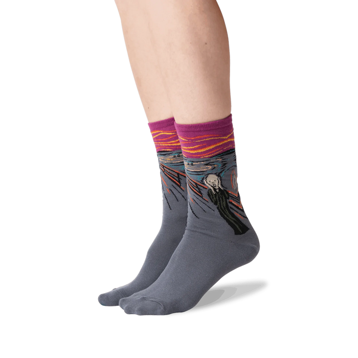 The Scream socks shown on a person's legs against a black background.