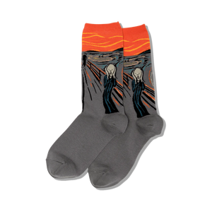 Lifestyle shot of The Scream socks on a person's feet surrounded by fall flowers.