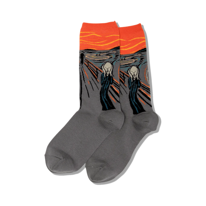 Lifestyle shot of The Scream socks on a person's feet surrounded by fall flowers.