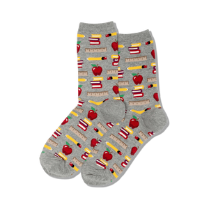 Grey crew socks with a repeating pattern of red apples, pencils, rulers, and stacks of books. Fun back-to-school design!