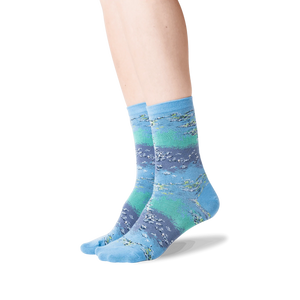 Lifestyle shot showing the Monet's Waterlilies socks on a woman's legs.