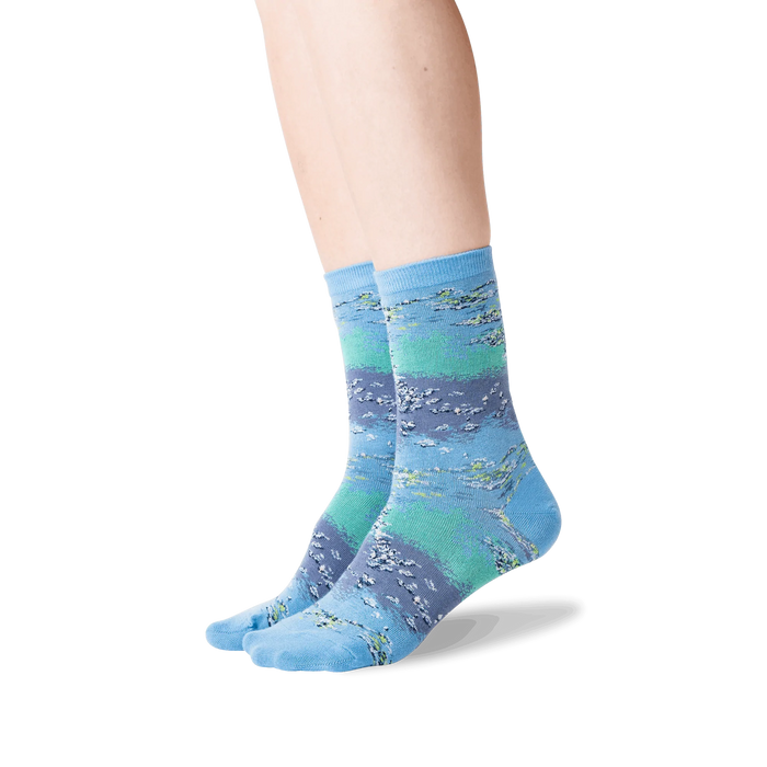 Lifestyle shot showing the Monet's Waterlilies socks on a woman's legs.
