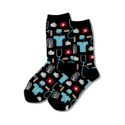 Pair of crew socks with a pattern of medical icons like stethoscopes, bandages, and first-aid kits in teal, red, and white on a black background.