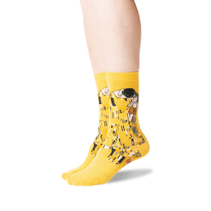 Close-up shot of Klimt's The Kiss socks on a person's legs, showing detail and fit.