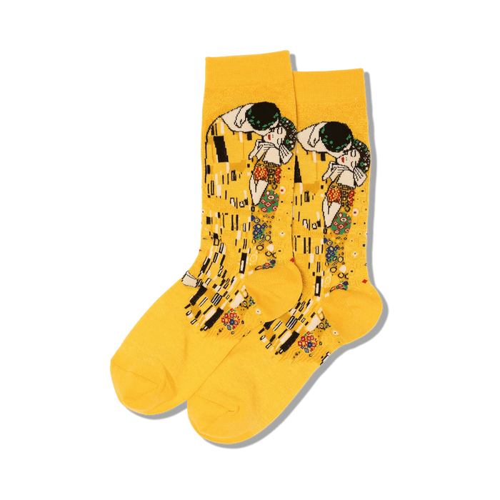 Pair of yellow crew socks featuring Gustav Klimt's The Kiss artwork.  Multicolored details on a mustard yellow background.