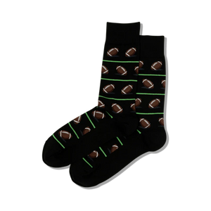 Pair of black crew socks with repeating pattern of brown footballs and lime green stripes.
