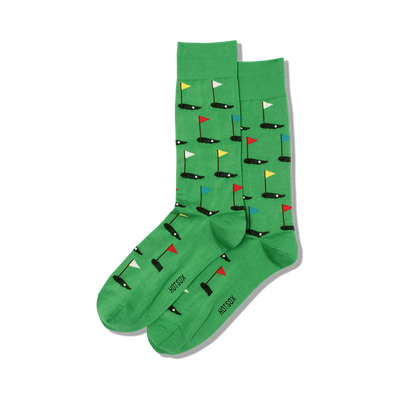 Pair of green crew socks with a repeating pattern of miniature golf holes and flags in red, yellow, blue, and white.