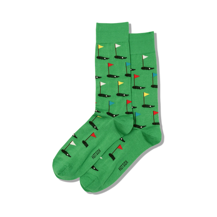 Pair of green crew socks with a repeating pattern of miniature golf holes and flags in red, yellow, blue, and white. }}