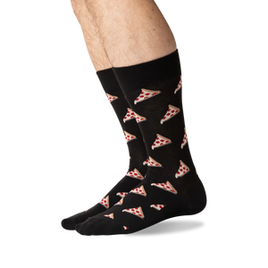 Lifestyle shot of a person wearing black pizza socks, showing the socks from the knees down.