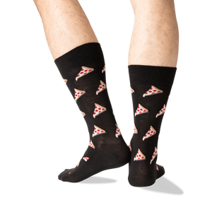 Rear view of the black pizza socks on a model, displaying the pizza pattern on the back of the socks.