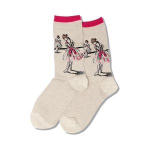 Close-up of a pair of beige crew socks with a pink top band, showcasing the detailed ballerina artwork.