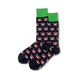 Pair of navy blue crew socks with a repeating pattern of red pirate skulls and crossbones. Green top trim.