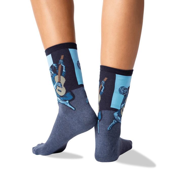 Back view of Picasso's Old Guitarist socks on a person's feet.  Shows off the design detail from the back.