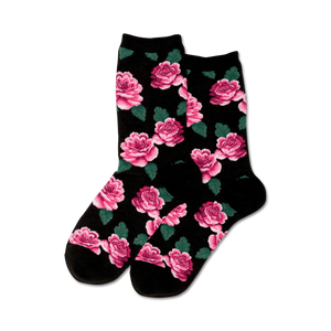 Pair of crew socks with a pink rose and green leaf pattern on a black background.