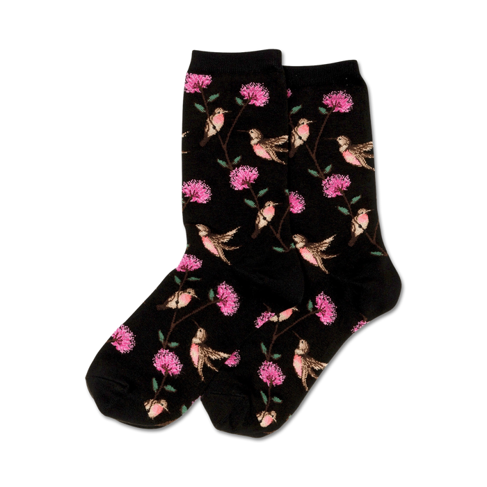 Pair of black crew socks with a whimsical pattern of pink flowers and hummingbirds.