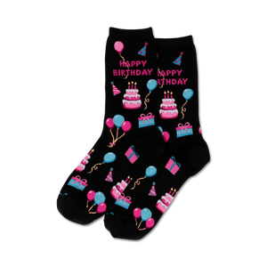 Pair of black crew socks with a fun 'Happy Birthday' theme.  Features pink, blue, and white pixelated cakes, balloons, and presents.
