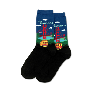 Pair of black crew socks with a colorful Golden Gate Bridge and San Francisco cable car design.  Features blue sky, red bridge, and yellow cable car.