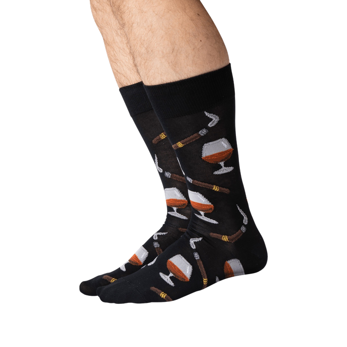 Lifestyle shot of a man's legs wearing the black Cognac and Cigars socks.