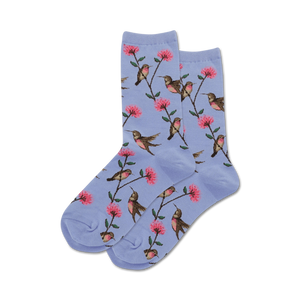 vibrant, colorful socks featuring repeating, pink flower and hummingbird patterns on a light blue background. crew length socks for women.  
