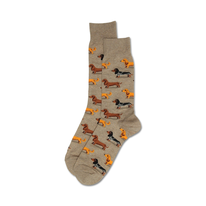 Pair of taupe crew socks with an all-over print of orange, brown, and black dachshunds. }}