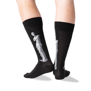 Back view of the Venus de Milo socks on a person's legs, showing the full design on the back of each sock.