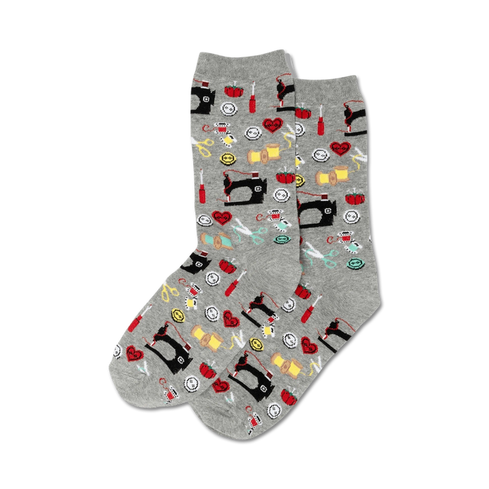 Pair of grey crew socks with colorful sewing-themed patterns: sewing machines, buttons, scissors, thread spools, and more. }}