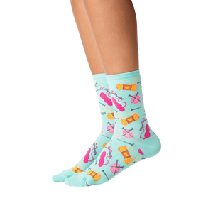 Lifestyle shot showing the socks on a person's legs against a black background.