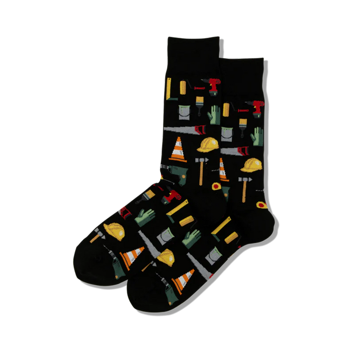 A pair of black crew socks with a fun pattern of colorful construction tools like hammers, hard hats, and paint cans. }}