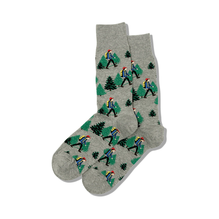 Close-up of grey Hiker socks showcasing the hiker and pine tree pattern.