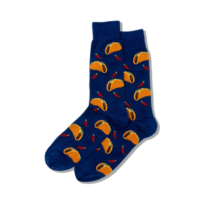 Lifestyle product shot showing a pair of blue crew socks with a taco and chili pepper print.
