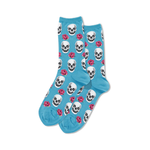 A pair of light blue crew socks with a repeating pattern of white skulls and pink roses.