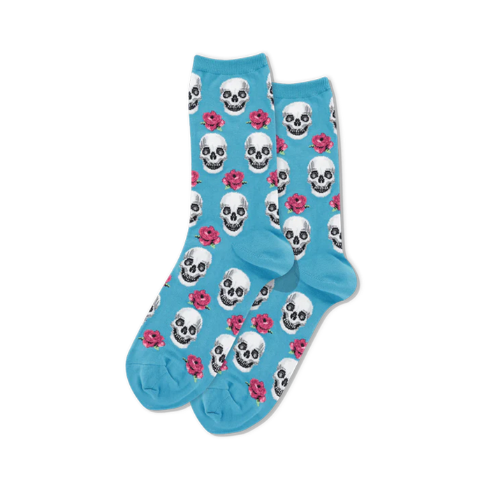 A pair of light blue crew socks with a repeating pattern of white skulls and pink roses.