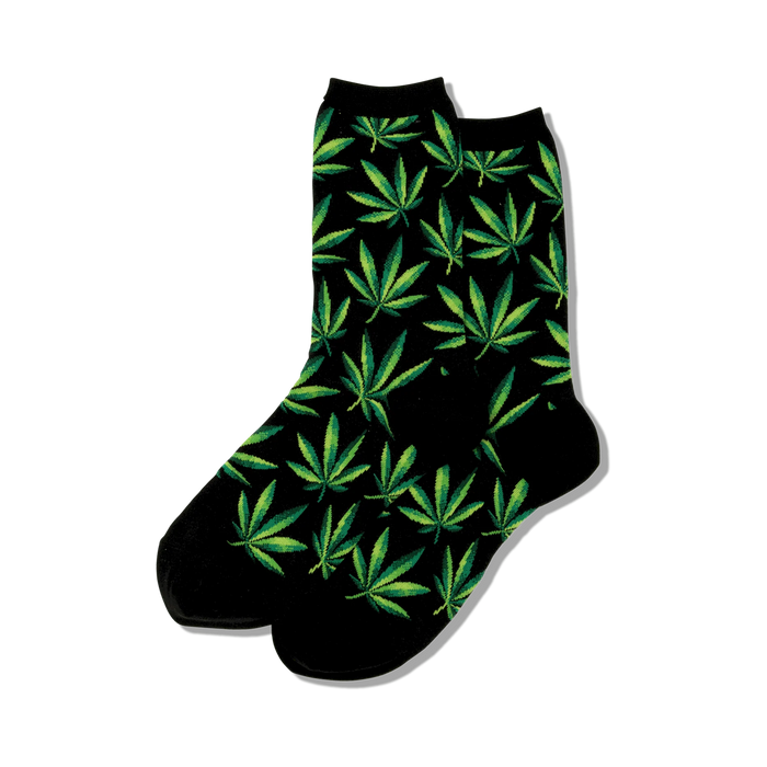 black crew socks featuring green cannabis leaf pattern.   