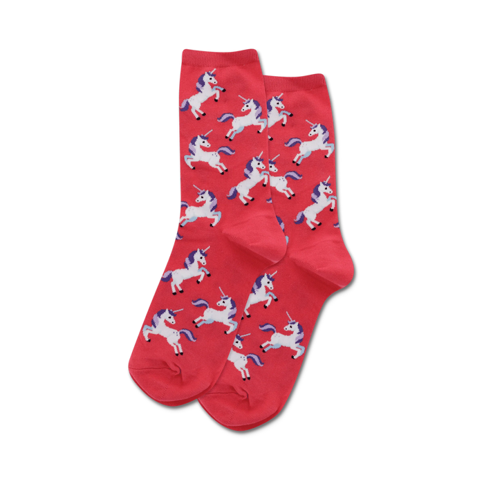 Close-up of coral crew socks with a pattern of white unicorns with purple manes and horns.