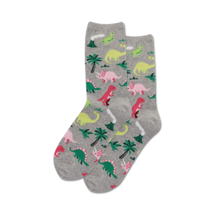 A pair of gray crew socks with a similar dinosaur design, but with pink, green and light gray dinosaurs.