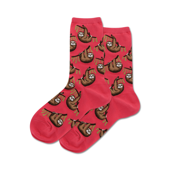 Pair of pink crew socks featuring a repeating pattern of brown sloths hanging from green branches.