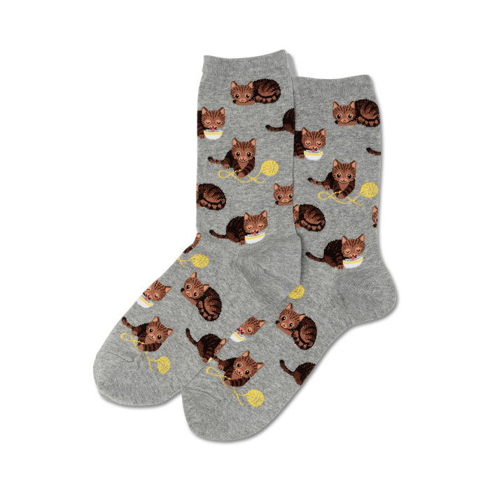 Pair of crew socks, grey and brown, featuring a repeating pattern of cute cats playing with yarn.