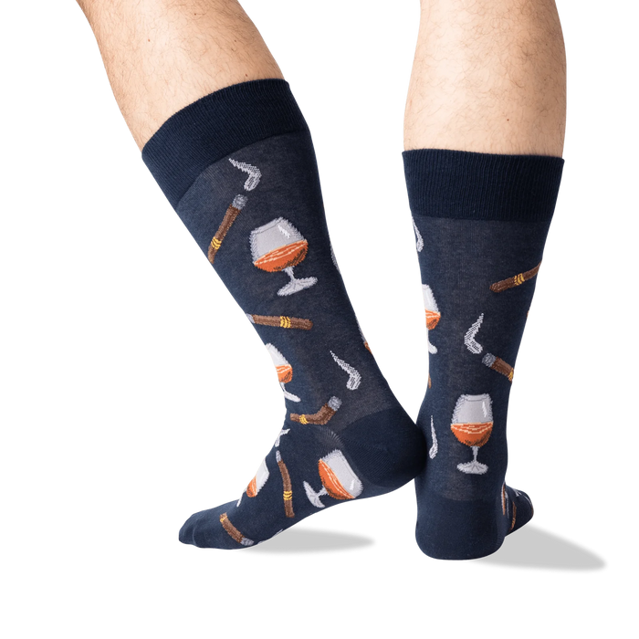 Lifestyle shot of a man's legs wearing the navy Cognac and Cigars socks.