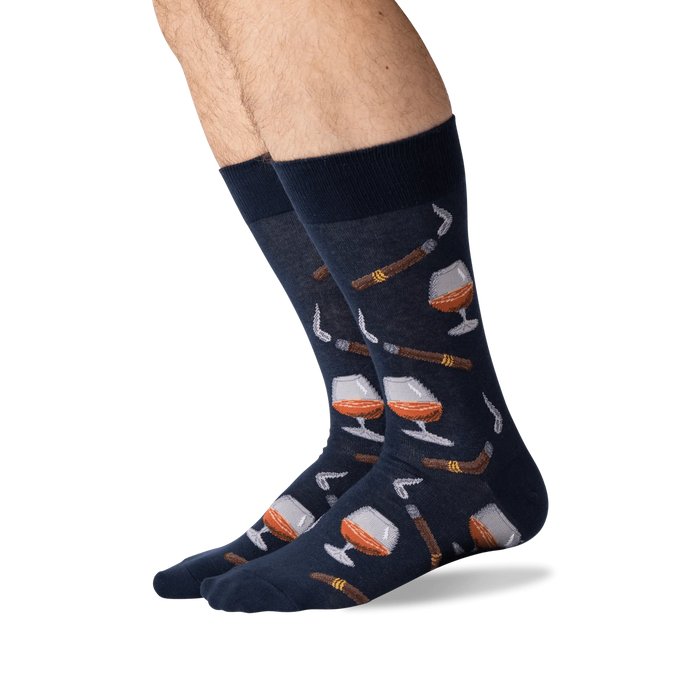 A pair of blue socks with a pattern of cognac glasses and cigars.