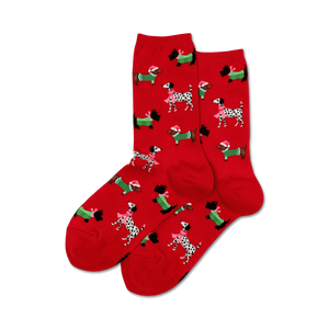 Pair of red crew socks with a repeating pattern of dachshunds and Scotties wearing Santa hats and green scarves.